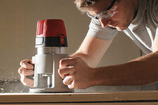 Man using a wood router